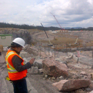 Representative of the independent engineer overlooking the excavation for the powerhouse.