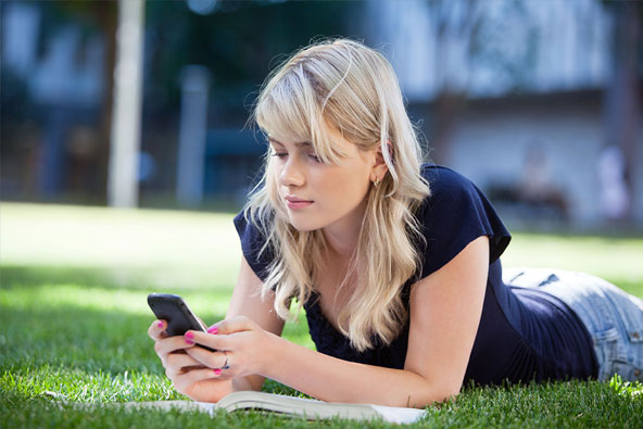 Young girl browsing mobile phone