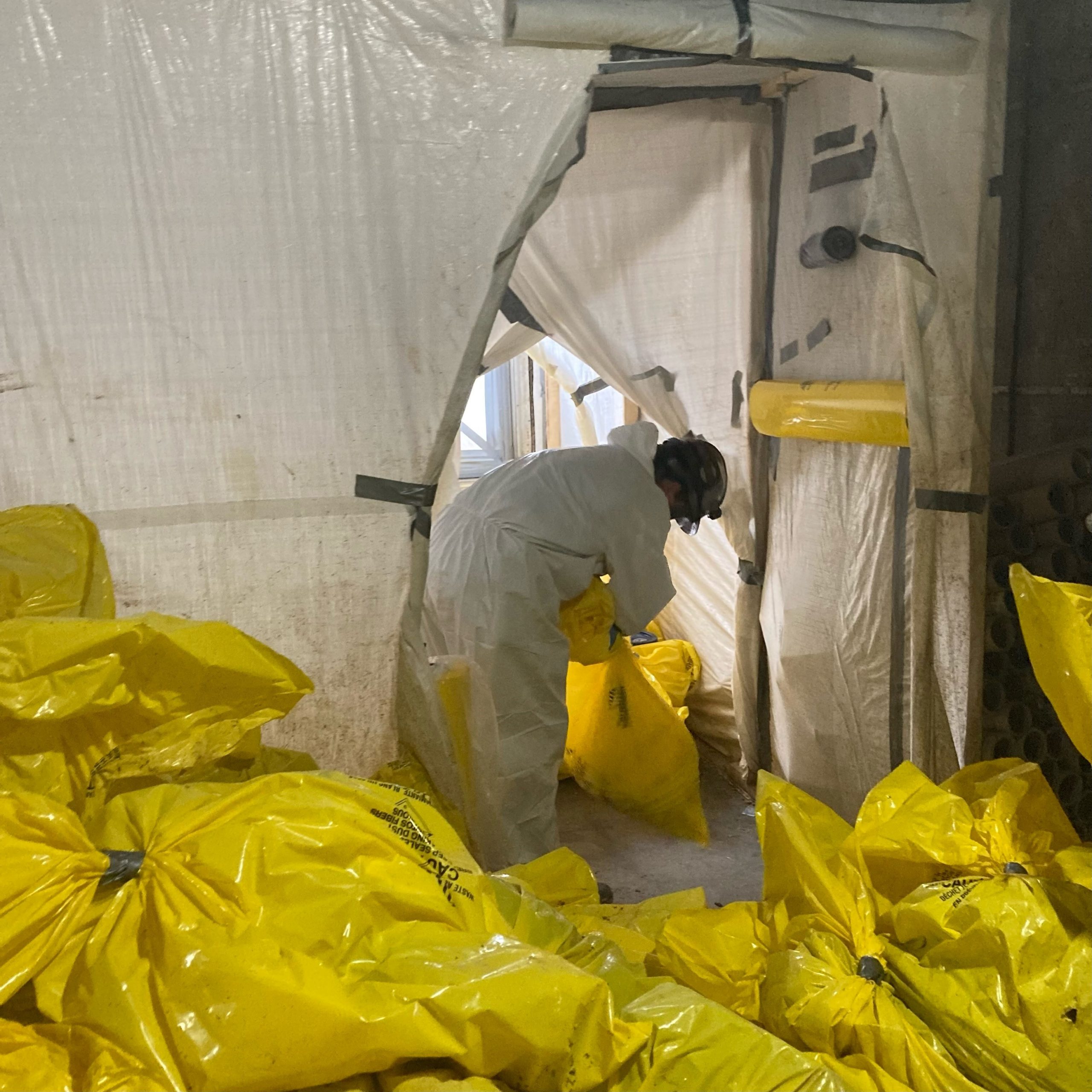 A photo of a person ting large yellow bags