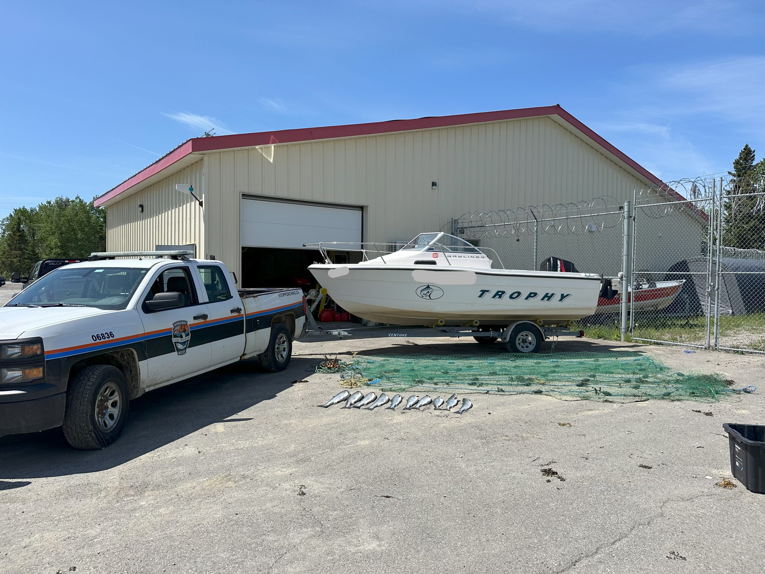 Resource Enforcement officers with the Department of Fisheries, Forestry and Agriculture recently seized a boat, motor, net and 10 Atlantic salmon following a poaching investigation. Two individuals were arrested for contravention of the Fisheries Act.